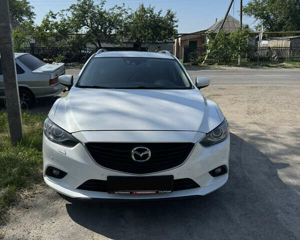 Белый Мазда 6, объемом двигателя 2.2 л и пробегом 230 тыс. км за 12800 $, фото 1 на Automoto.ua