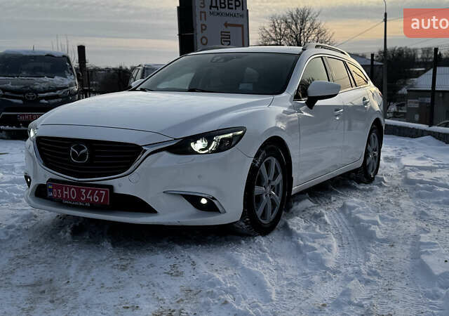 Білий Мазда 6, об'ємом двигуна 2.2 л та пробігом 170 тис. км за 13899 $, фото 1 на Automoto.ua