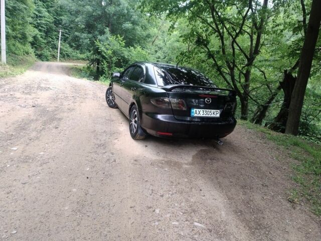 Черный Мазда 6, объемом двигателя 2 л и пробегом 300 тыс. км за 3021 $, фото 1 на Automoto.ua