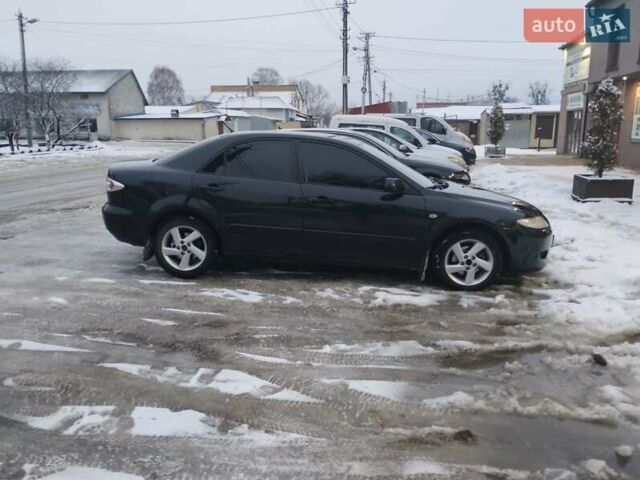 Черный Мазда 6, объемом двигателя 2 л и пробегом 350 тыс. км за 2400 $, фото 1 на Automoto.ua