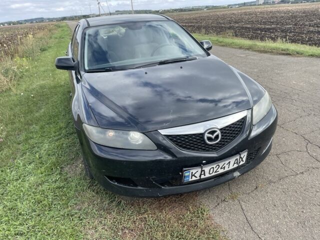 Черный Мазда 6, объемом двигателя 2 л и пробегом 330 тыс. км за 2859 $, фото 1 на Automoto.ua
