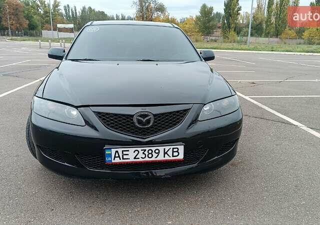 Черный Мазда 6, объемом двигателя 2 л и пробегом 300 тыс. км за 3900 $, фото 1 на Automoto.ua