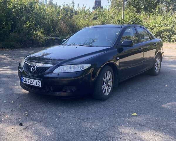 Черный Мазда 6, объемом двигателя 1.99 л и пробегом 287 тыс. км за 2950 $, фото 1 на Automoto.ua