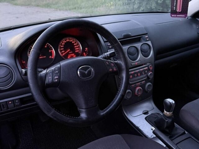 Черный Мазда 6, объемом двигателя 2 л и пробегом 315 тыс. км за 501 $, фото 1 на Automoto.ua