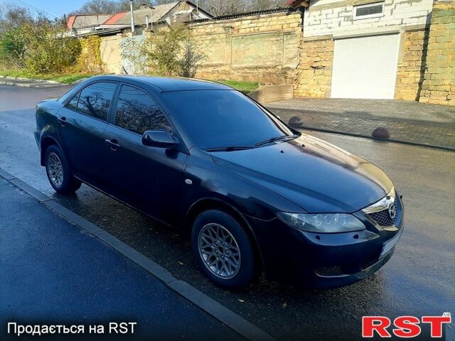 Черный Мазда 6, объемом двигателя 1.8 л и пробегом 300 тыс. км за 2999 $, фото 1 на Automoto.ua