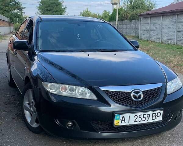 Черный Мазда 6, объемом двигателя 2 л и пробегом 375 тыс. км за 3900 $, фото 1 на Automoto.ua