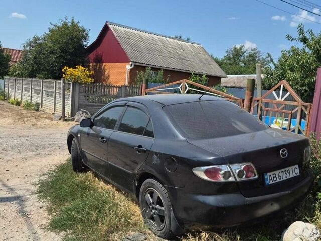 Черный Мазда 6, объемом двигателя 2 л и пробегом 300 тыс. км за 2600 $, фото 1 на Automoto.ua