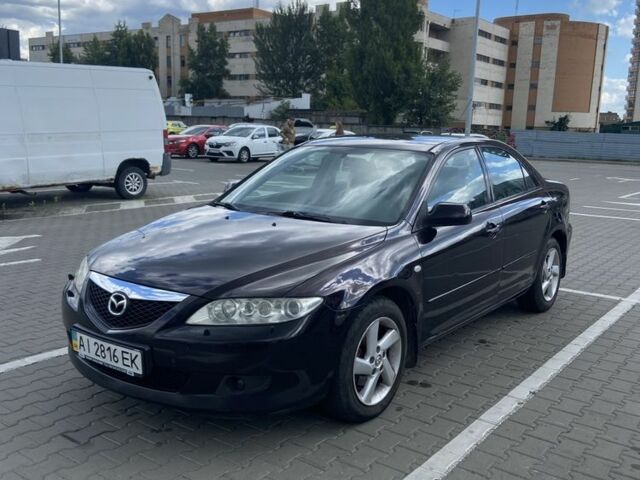 Черный Мазда 6, объемом двигателя 2 л и пробегом 240 тыс. км за 2600 $, фото 1 на Automoto.ua