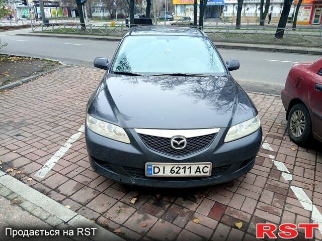 Черный Мазда 6, объемом двигателя 1.8 л и пробегом 304 тыс. км за 5000 $, фото 1 на Automoto.ua