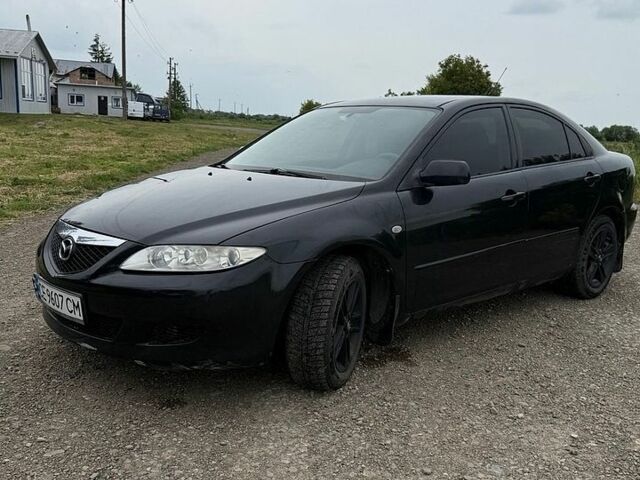 Черный Мазда 6, объемом двигателя 2 л и пробегом 212 тыс. км за 3400 $, фото 1 на Automoto.ua