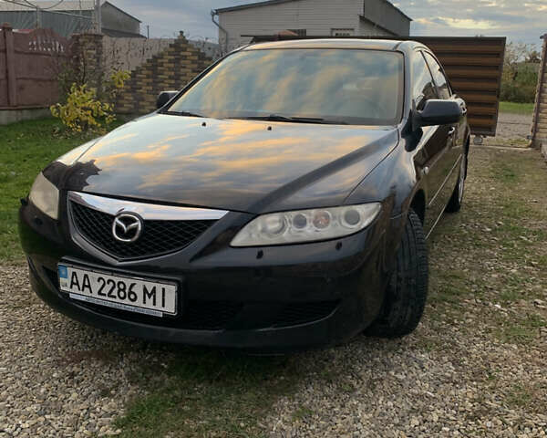 Черный Мазда 6, объемом двигателя 2 л и пробегом 202 тыс. км за 4300 $, фото 1 на Automoto.ua