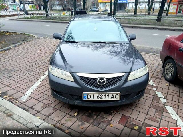 Черный Мазда 6, объемом двигателя 1.8 л и пробегом 320 тыс. км за 4500 $, фото 1 на Automoto.ua