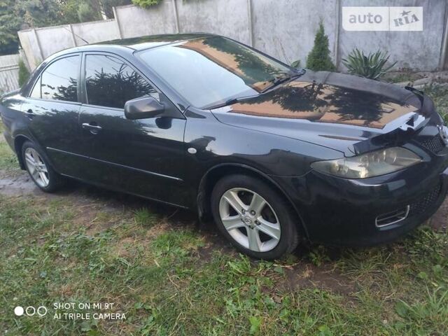 Черный Мазда 6, объемом двигателя 1.8 л и пробегом 250 тыс. км за 4200 $, фото 1 на Automoto.ua