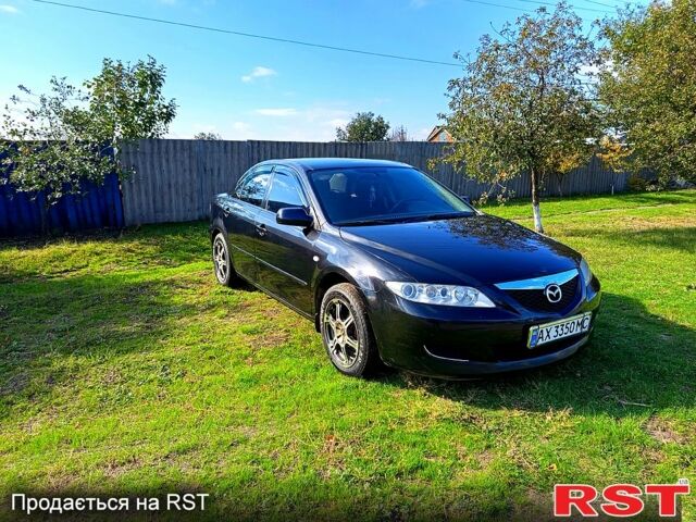 Черный Мазда 6, объемом двигателя 2 л и пробегом 290 тыс. км за 5200 $, фото 1 на Automoto.ua