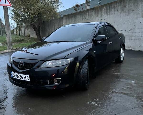 Черный Мазда 6, объемом двигателя 1.8 л и пробегом 301 тыс. км за 3800 $, фото 1 на Automoto.ua