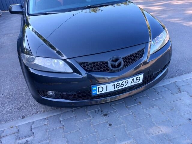 Черный Мазда 6, объемом двигателя 1.8 л и пробегом 225 тыс. км за 4989 $, фото 1 на Automoto.ua