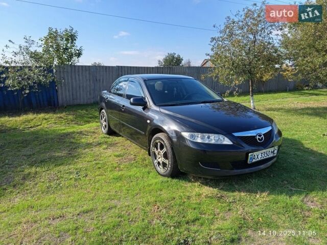 Черный Мазда 6, объемом двигателя 2 л и пробегом 234 тыс. км за 5800 $, фото 1 на Automoto.ua