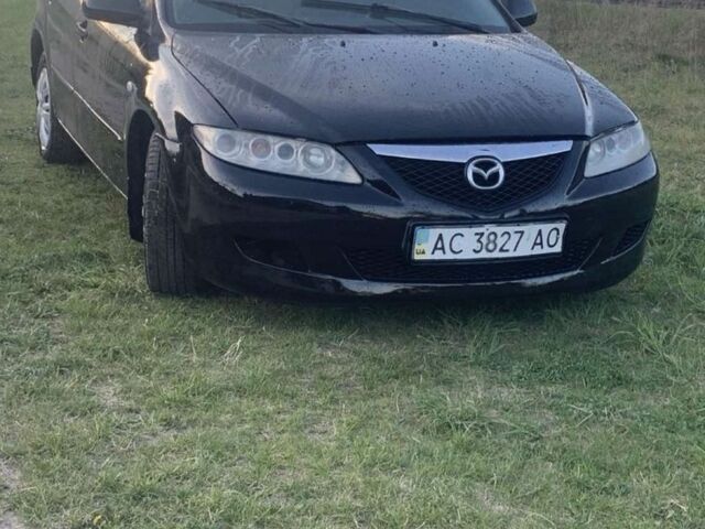Черный Мазда 6, объемом двигателя 1.8 л и пробегом 300 тыс. км за 2150 $, фото 1 на Automoto.ua