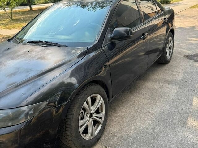 Чорний Мазда 6, об'ємом двигуна 1.8 л та пробігом 324 тис. км за 3500 $, фото 1 на Automoto.ua