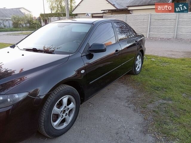 Черный Мазда 6, объемом двигателя 2 л и пробегом 206 тыс. км за 4399 $, фото 1 на Automoto.ua