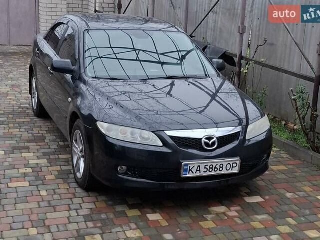 Черный Мазда 6, объемом двигателя 2 л и пробегом 183 тыс. км за 4000 $, фото 1 на Automoto.ua