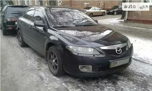 Черный Мазда 6, объемом двигателя 2 л и пробегом 260 тыс. км за 6300 $, фото 1 на Automoto.ua