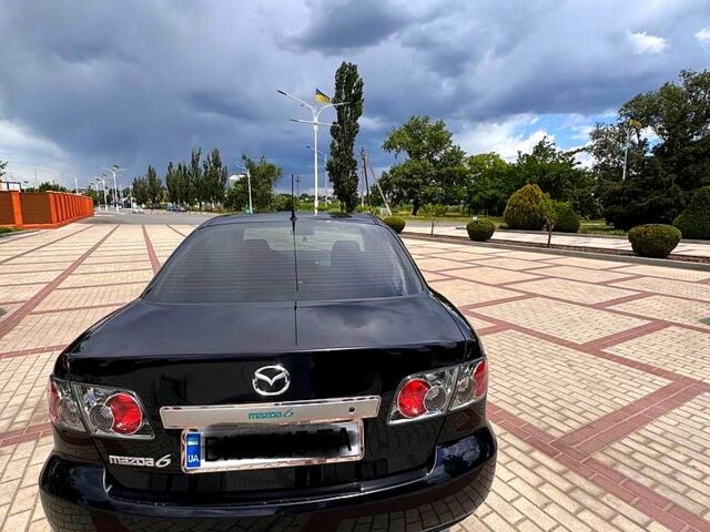 Черный Мазда 6, объемом двигателя 2 л и пробегом 235 тыс. км за 5500 $, фото 1 на Automoto.ua