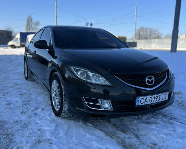 Черный Мазда 6, объемом двигателя 2 л и пробегом 252 тыс. км за 7200 $, фото 1 на Automoto.ua