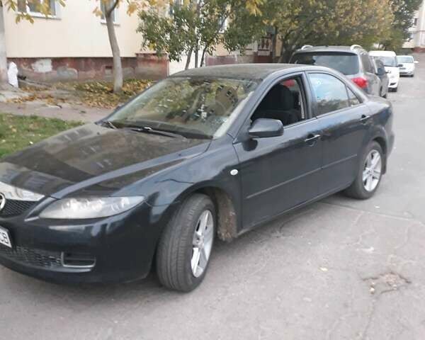 Черный Мазда 6, объемом двигателя 1.8 л и пробегом 210 тыс. км за 6500 $, фото 1 на Automoto.ua