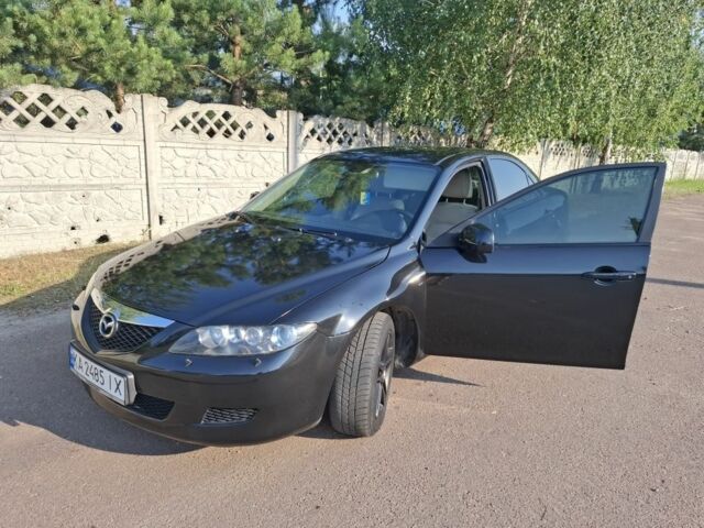 Черный Мазда 6, объемом двигателя 2 л и пробегом 335 тыс. км за 4650 $, фото 1 на Automoto.ua