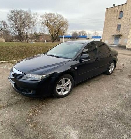 Черный Мазда 6, объемом двигателя 2 л и пробегом 245 тыс. км за 5700 $, фото 1 на Automoto.ua