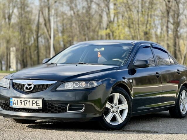 Черный Мазда 6, объемом двигателя 2 л и пробегом 314 тыс. км за 5800 $, фото 1 на Automoto.ua