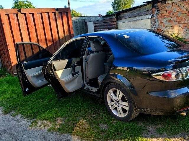 Черный Мазда 6, объемом двигателя 2 л и пробегом 250 тыс. км за 4500 $, фото 1 на Automoto.ua
