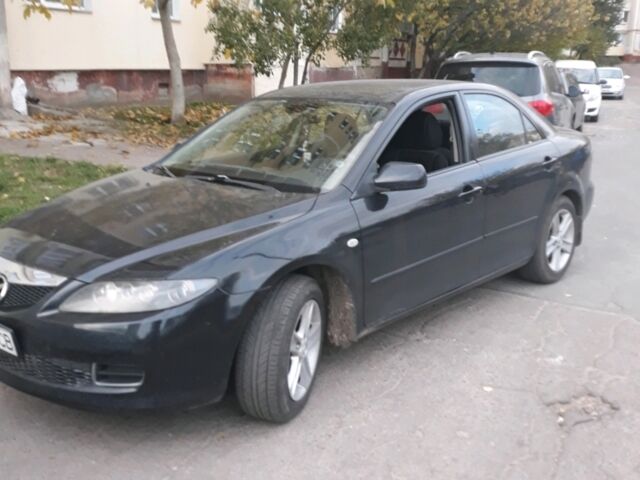 Черный Мазда 6, объемом двигателя 1.8 л и пробегом 210 тыс. км за 6500 $, фото 1 на Automoto.ua
