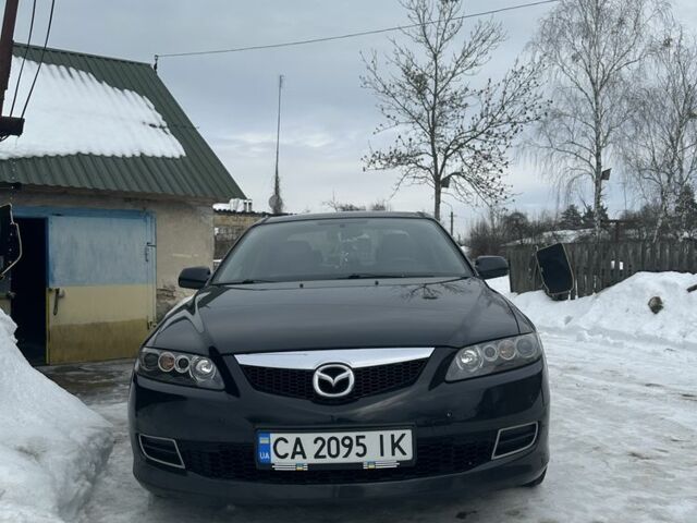 Черный Мазда 6, объемом двигателя 2 л и пробегом 230 тыс. км за 7100 $, фото 1 на Automoto.ua