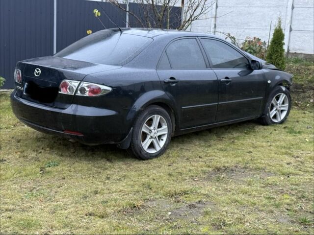 Черный Мазда 6, объемом двигателя 1.8 л и пробегом 245 тыс. км за 1650 $, фото 1 на Automoto.ua