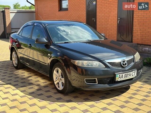 Черный Мазда 6, объемом двигателя 1.8 л и пробегом 303 тыс. км за 6000 $, фото 1 на Automoto.ua