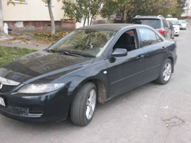 Черный Мазда 6, объемом двигателя 1.8 л и пробегом 210 тыс. км за 6500 $, фото 1 на Automoto.ua