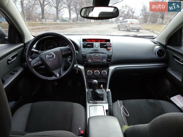 Черный Мазда 6, объемом двигателя 2 л и пробегом 157 тыс. км за 9200 $, фото 1 на Automoto.ua