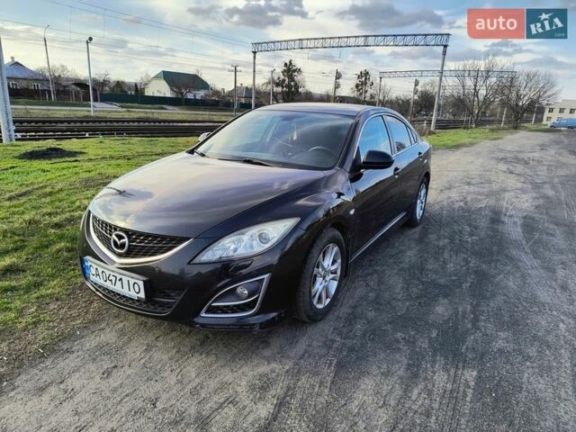 Черный Мазда 6, объемом двигателя 1.8 л и пробегом 245 тыс. км за 5700 $, фото 1 на Automoto.ua