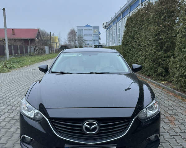 Черный Мазда 6, объемом двигателя 2.2 л и пробегом 325 тыс. км за 13000 $, фото 1 на Automoto.ua