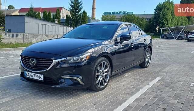 Черный Мазда 6, объемом двигателя 2.49 л и пробегом 210 тыс. км за 11800 $, фото 1 на Automoto.ua