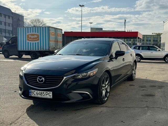 Черный Мазда 6, объемом двигателя 2.49 л и пробегом 175 тыс. км за 13300 $, фото 1 на Automoto.ua