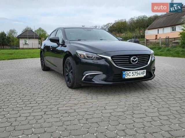 Черный Мазда 6, объемом двигателя 2.2 л и пробегом 100 тыс. км за 16200 $, фото 1 на Automoto.ua