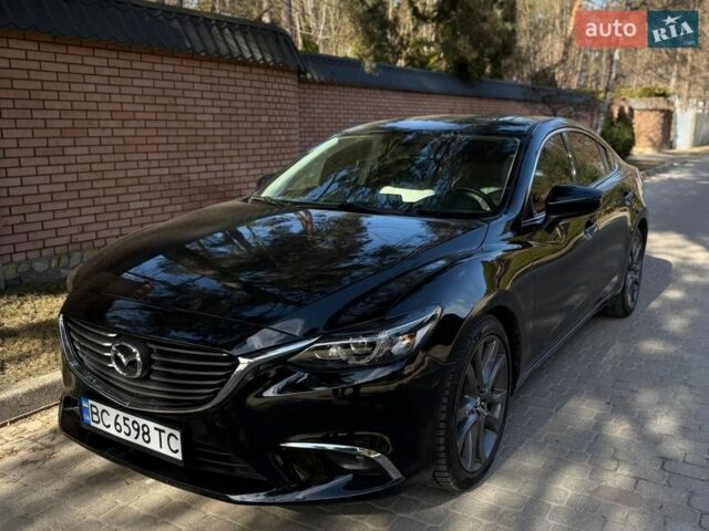 Черный Мазда 6, объемом двигателя 2.49 л и пробегом 185 тыс. км за 13100 $, фото 1 на Automoto.ua