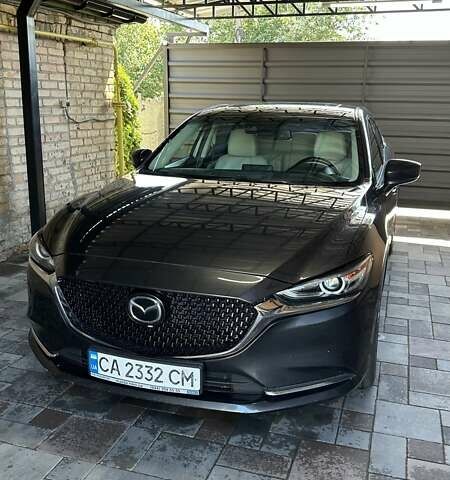 Черный Мазда 6, объемом двигателя 2.49 л и пробегом 125 тыс. км за 19400 $, фото 1 на Automoto.ua