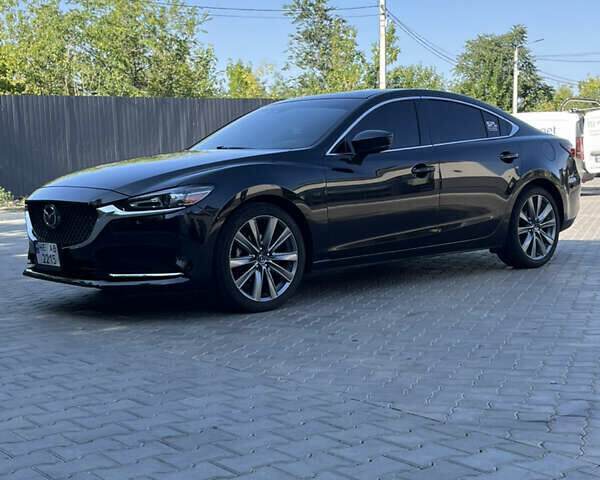 Черный Мазда 6, объемом двигателя 2.49 л и пробегом 146 тыс. км за 16999 $, фото 1 на Automoto.ua