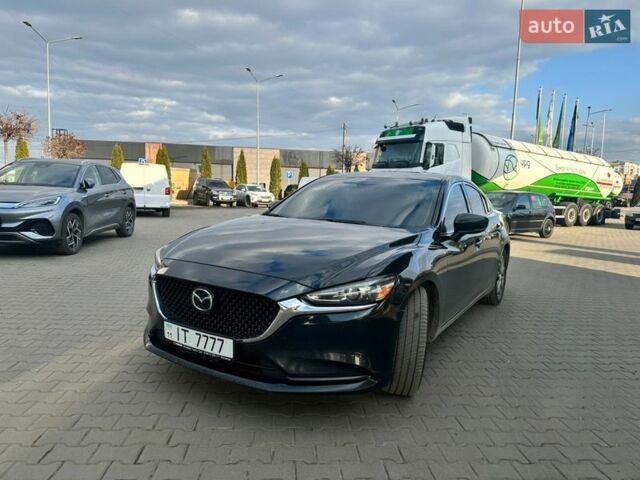 Черный Мазда 6, объемом двигателя 2.49 л и пробегом 128 тыс. км за 16000 $, фото 1 на Automoto.ua