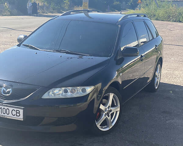 Черный Мазда 6, объемом двигателя 1.8 л и пробегом 296 тыс. км за 5700 $, фото 1 на Automoto.ua