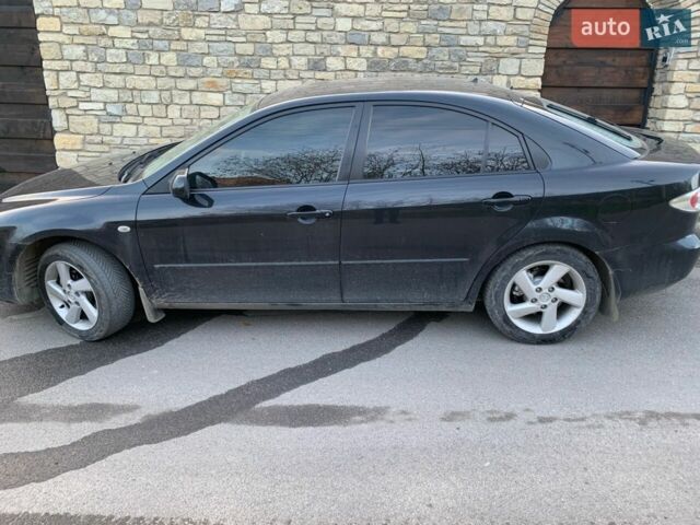Черный Мазда 6, объемом двигателя 1.8 л и пробегом 272 тыс. км за 3800 $, фото 1 на Automoto.ua